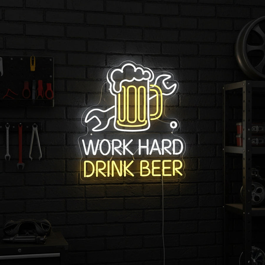 Neon sign with beer mug, wrench, and text “WORK HARD DRINK BEER,” perfect for garages or home bars.